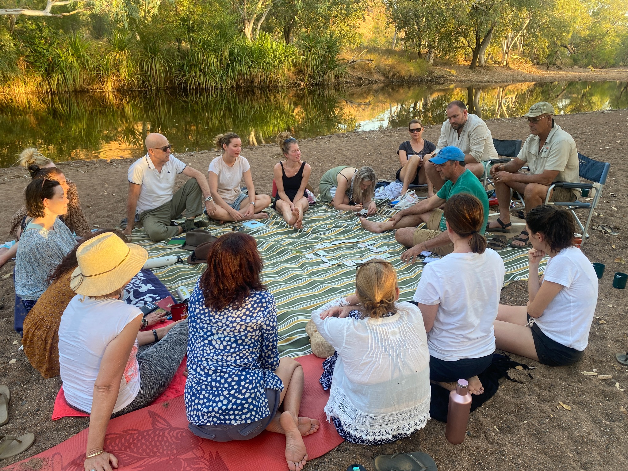 A group listening together during a facilitated conversation on Country